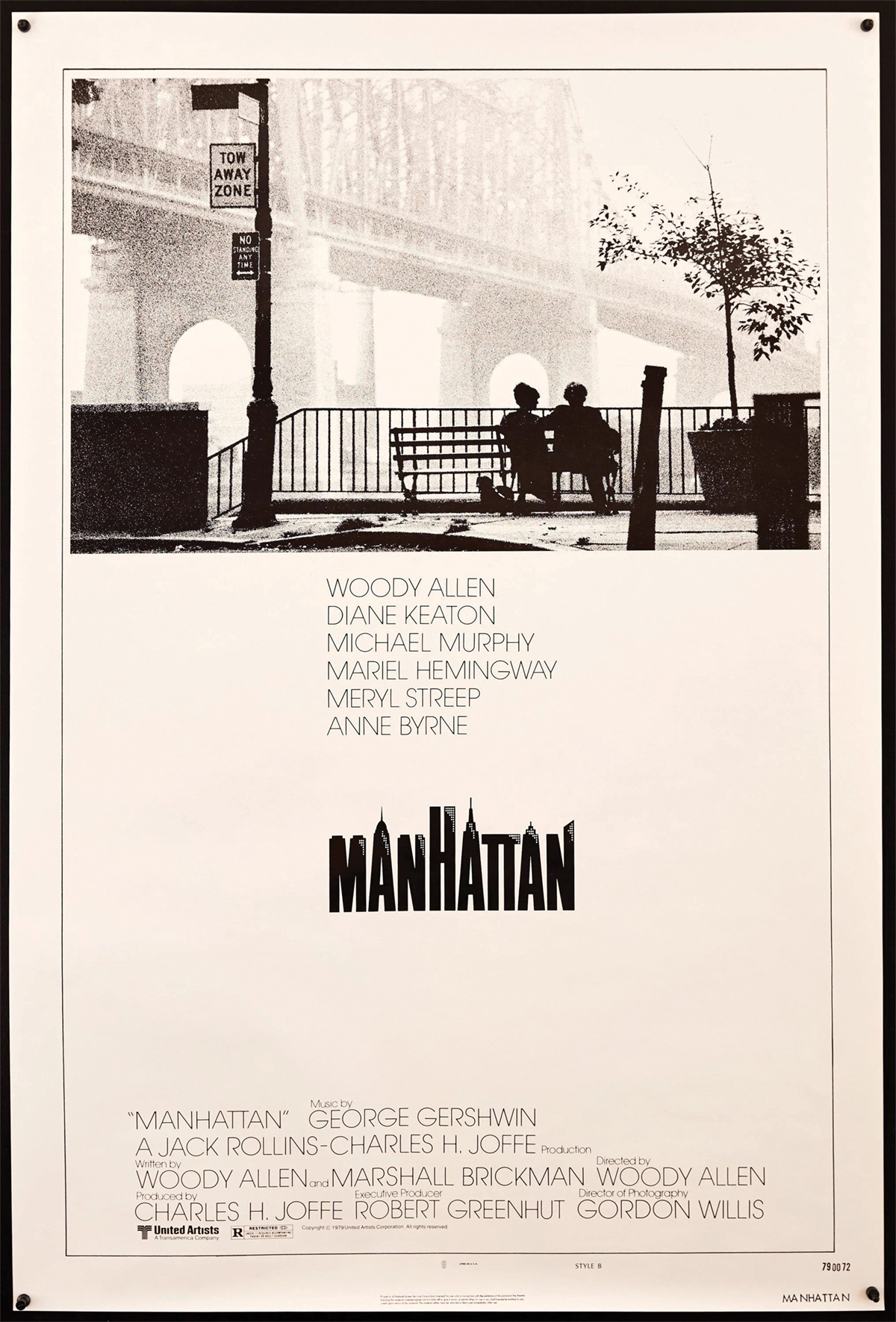 A movie poster of a movie 'Manhattan' of a silhouette of a couple sitting on a bench by the river.