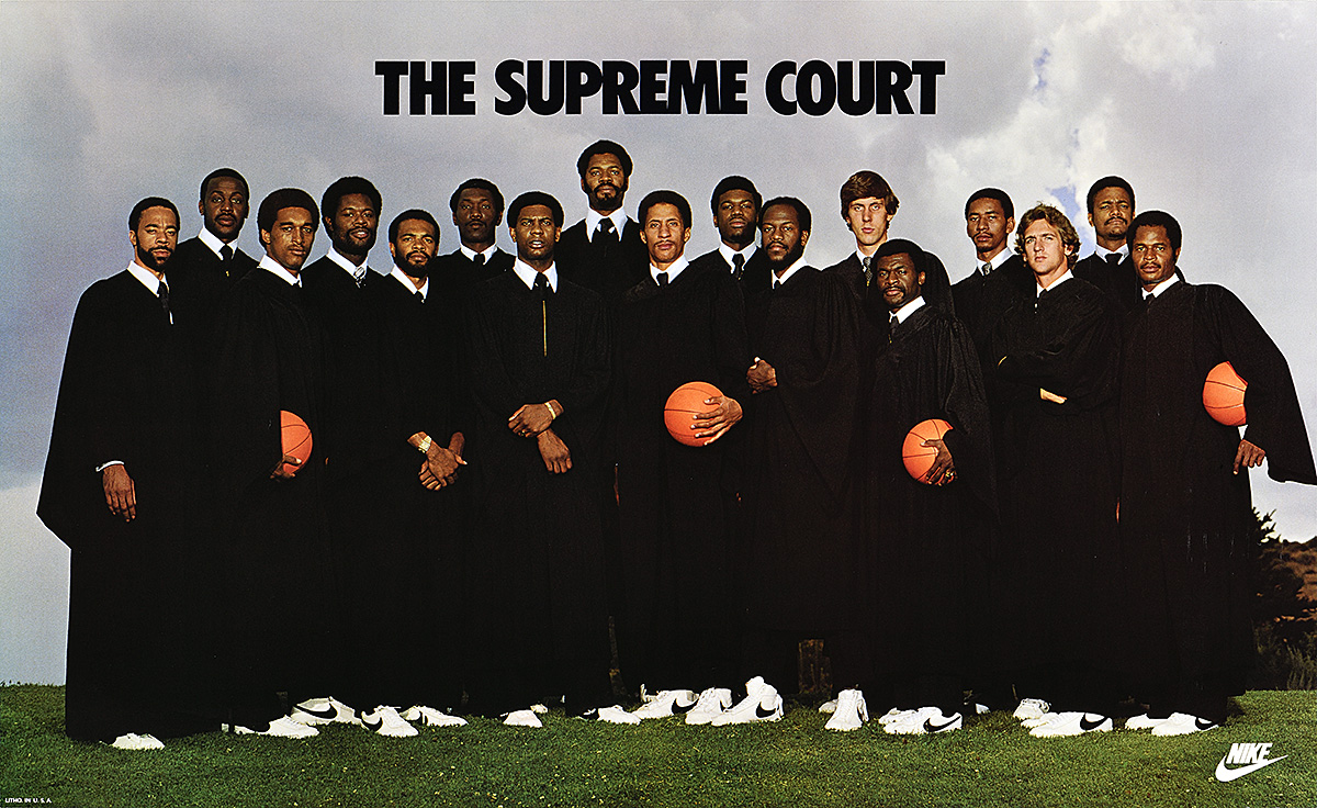 A poster of 17 basketball players in black judges' robes and holding basketballs against a cloudy sky.