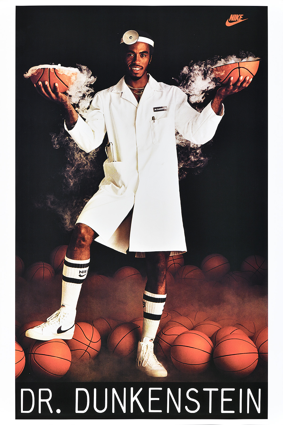 A poster of a Black man in a doctor's outfit holding the smoking halves of a split basketball.