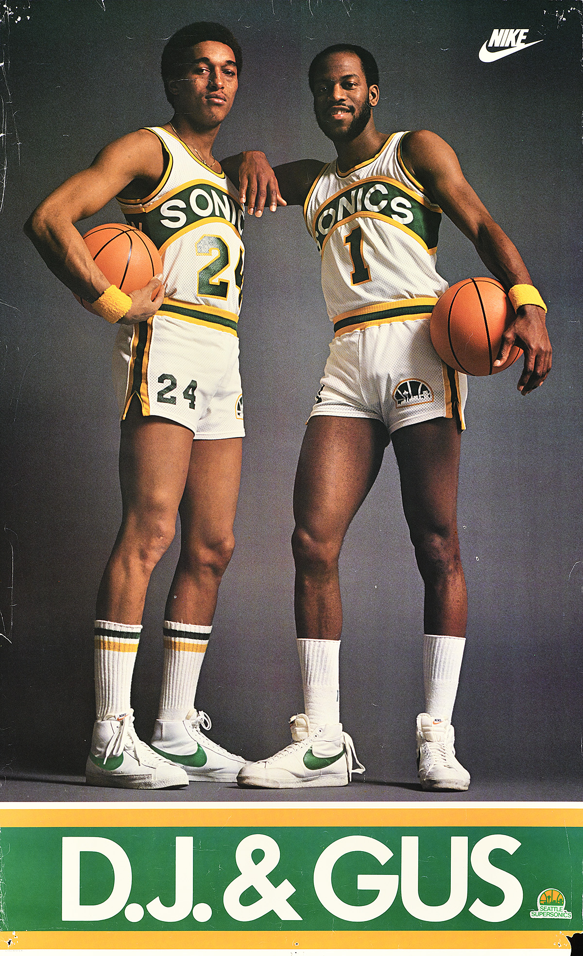 A poster of 2 Black men in baseball uniforms, leaning together and holding basketballs.