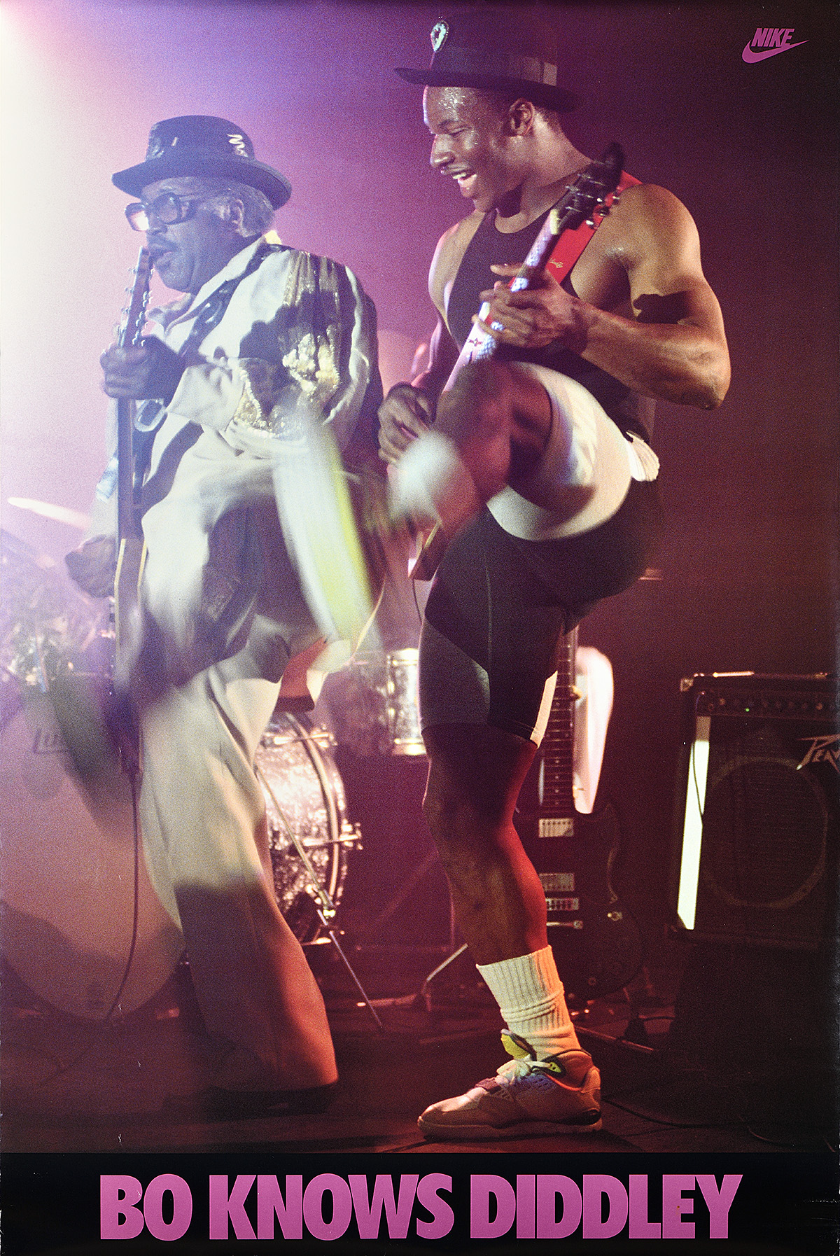 A poster of 2 Black men playing guitar on a spotlit stage, both kicking out their left legs.