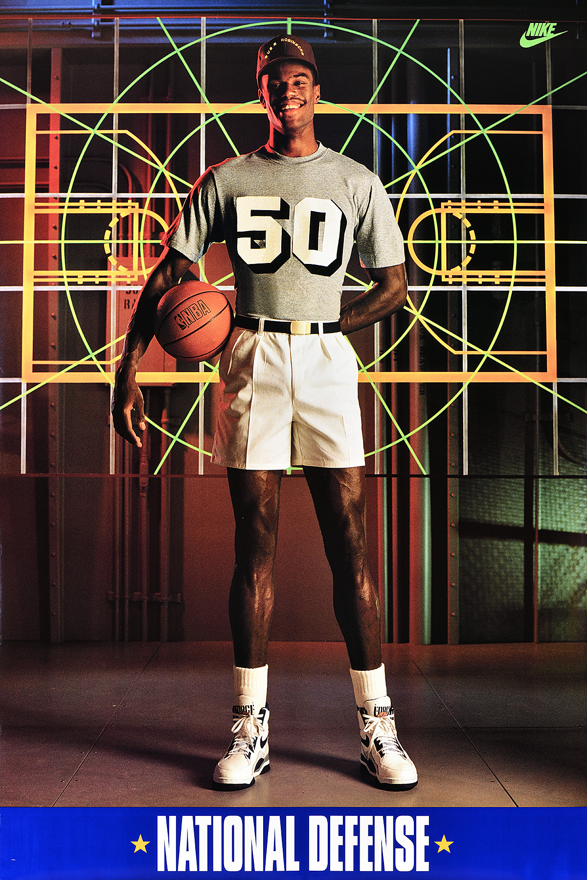 A poster of a tall Black man holding a basketball in front of a colorful diagram of a basketball court.