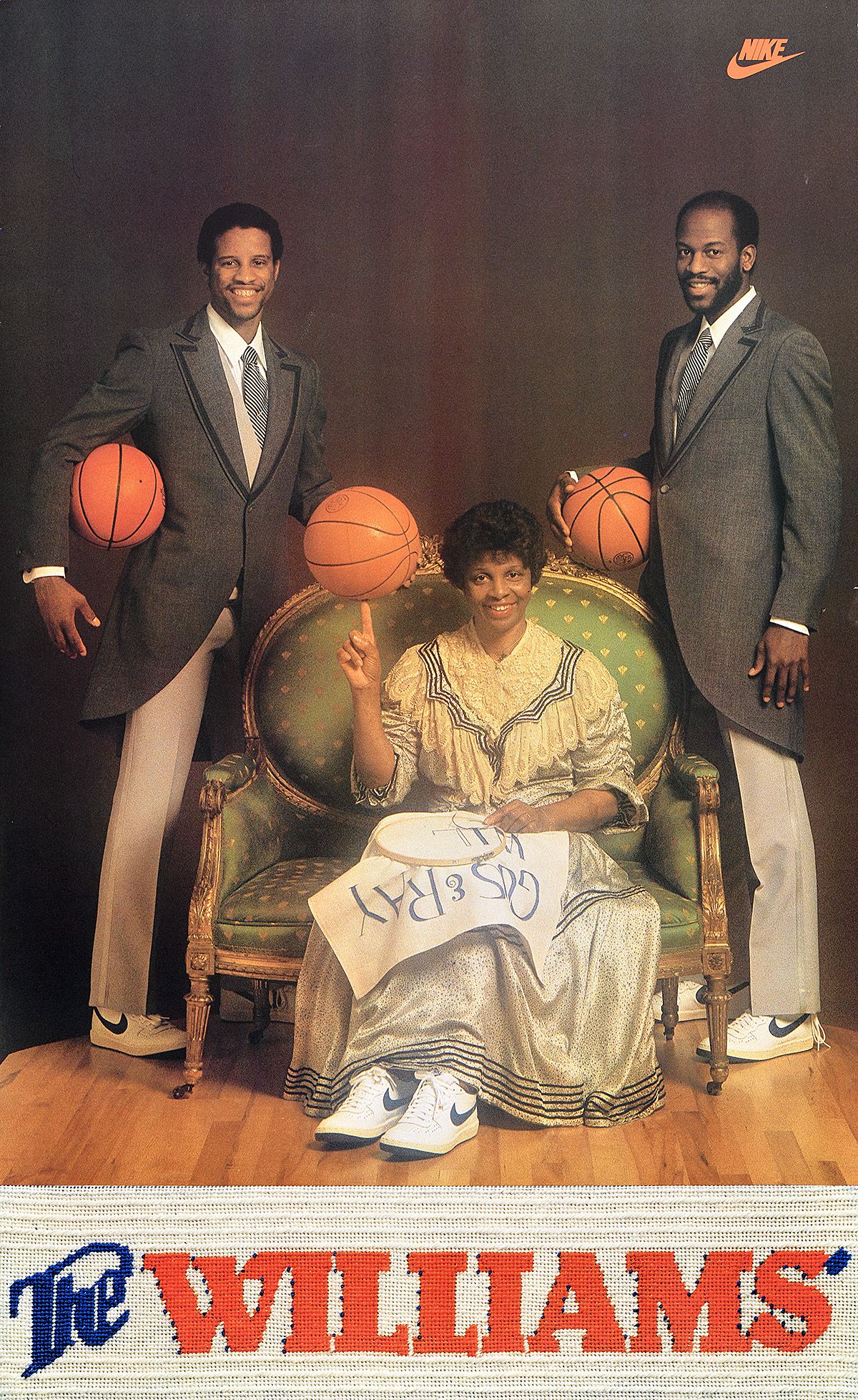 A poster of 2 Black men standing next to a seated Black woman with embroidery, all holding basketballs.