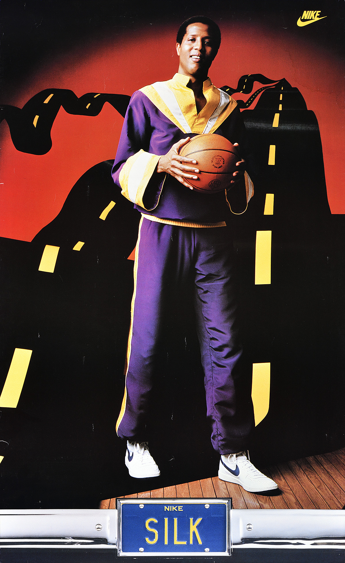 A poster of a Black man in a purple outfit holding a basketball in front of a fluttering silk road.