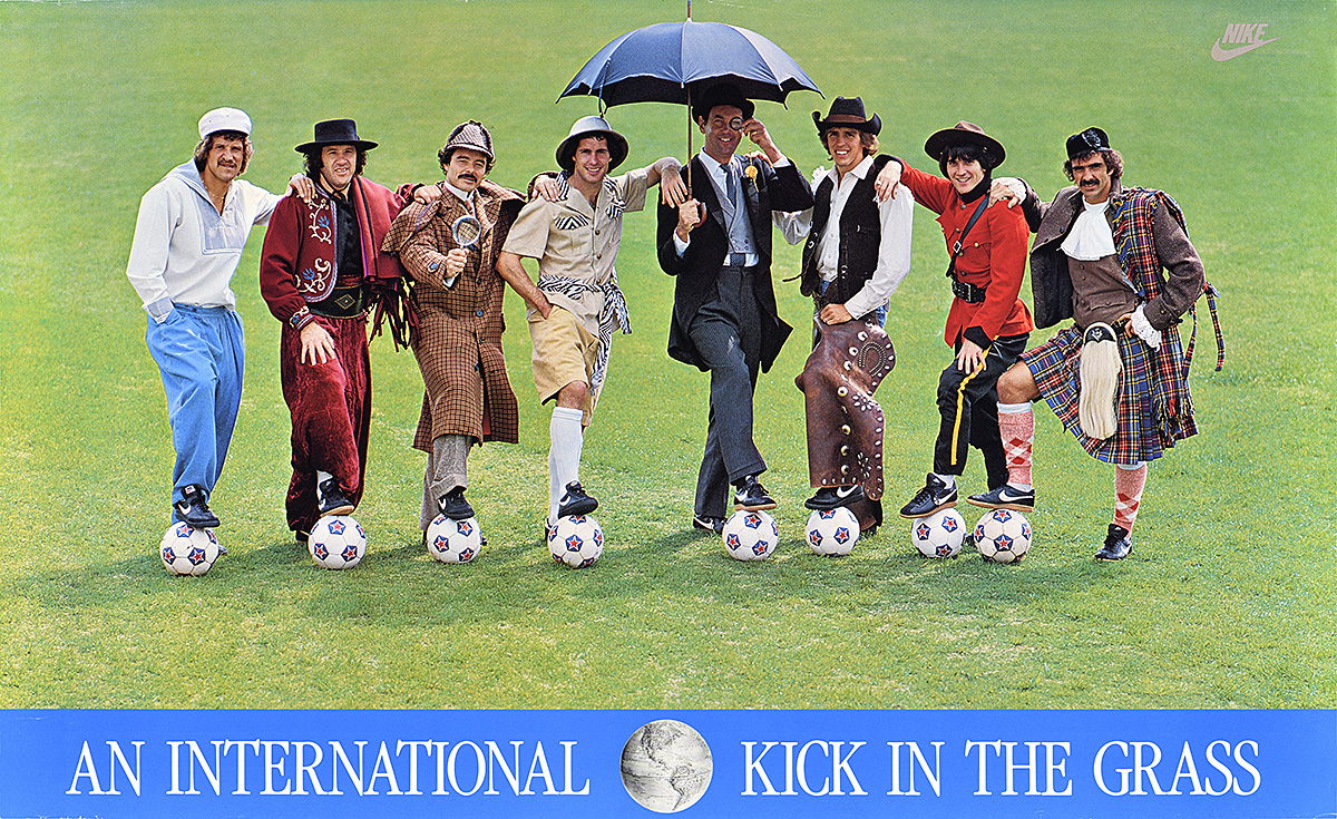 A poster of 8 white men in various costumes posing with their feet on soccer balls.