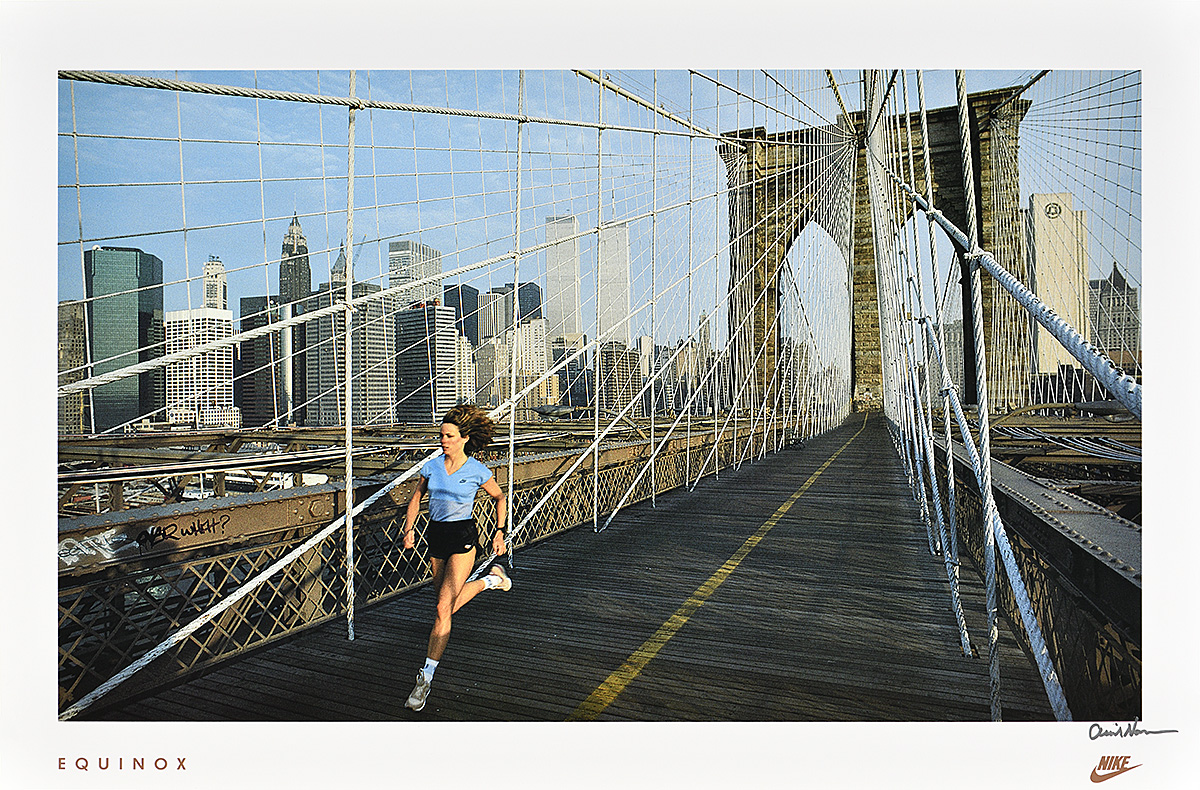 A poster of a white woman running on the Brooklyn Bridge with the Manhattan skyline in the background.