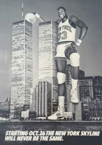 An image of a basketball player posing with buildings, who is the same size as the buildings. 