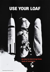 A poster of a nuclear missile next to two loaves of bread