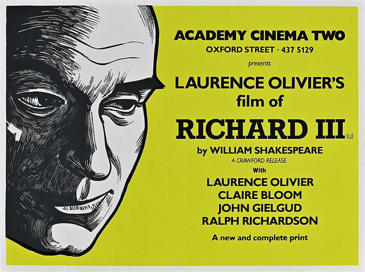 A poster of a white man's face looking downwards with an ambiguous smile.