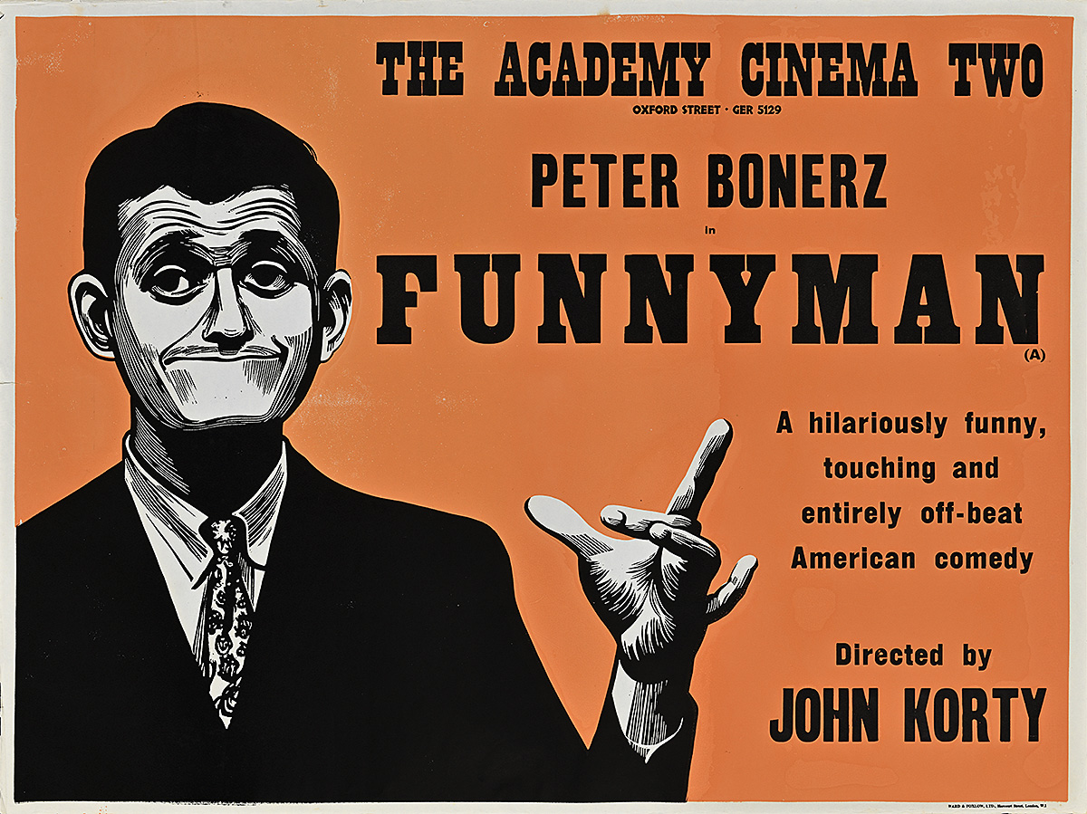 A poster of a white man in a suit with pursed lips holding his fingers in an L shape.