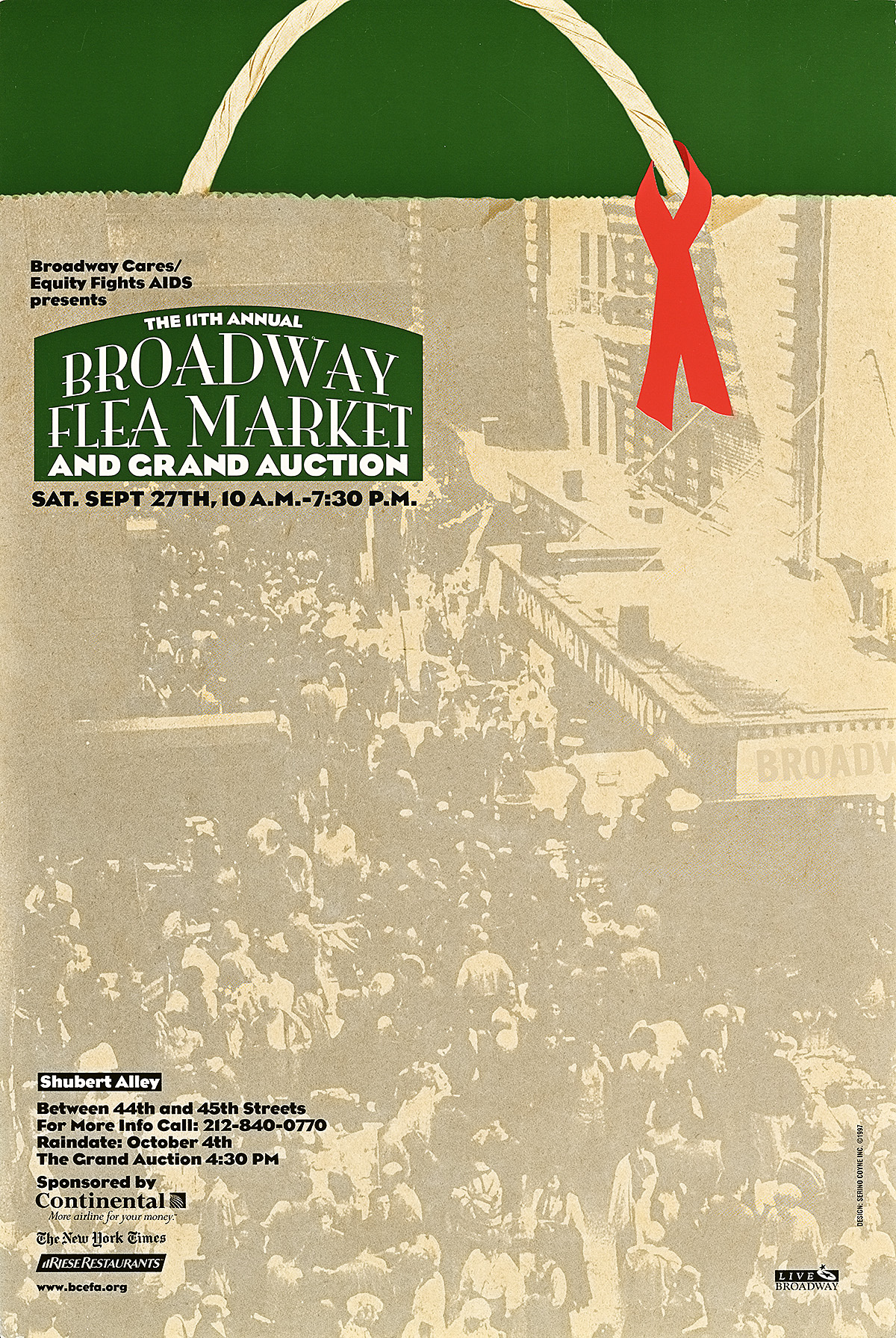 A poster of a black and white street scene printed on a paper bag with a red scarf draped over the handles.