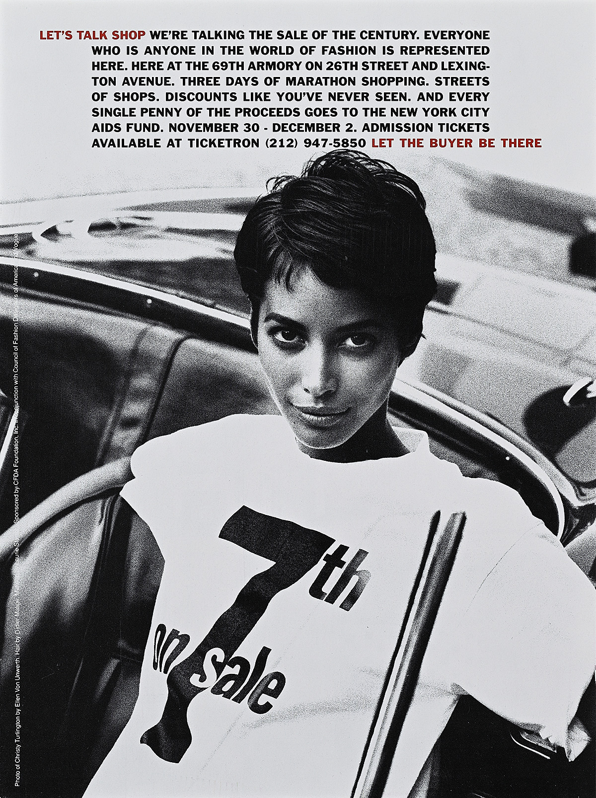 A magazine showing a woman with medium-tone skin standing in front of a car looking at the viewer in black and white.