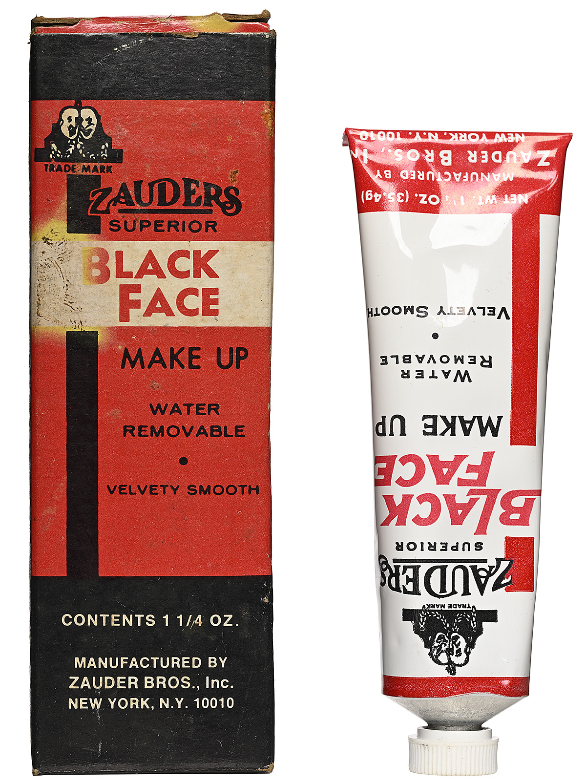 A red and black rectangular box next to an upside down red and white tube.