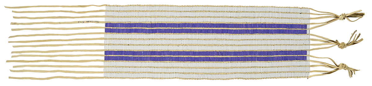 A woven belt made of horizontal white and purple stripes and three knots at the right end.