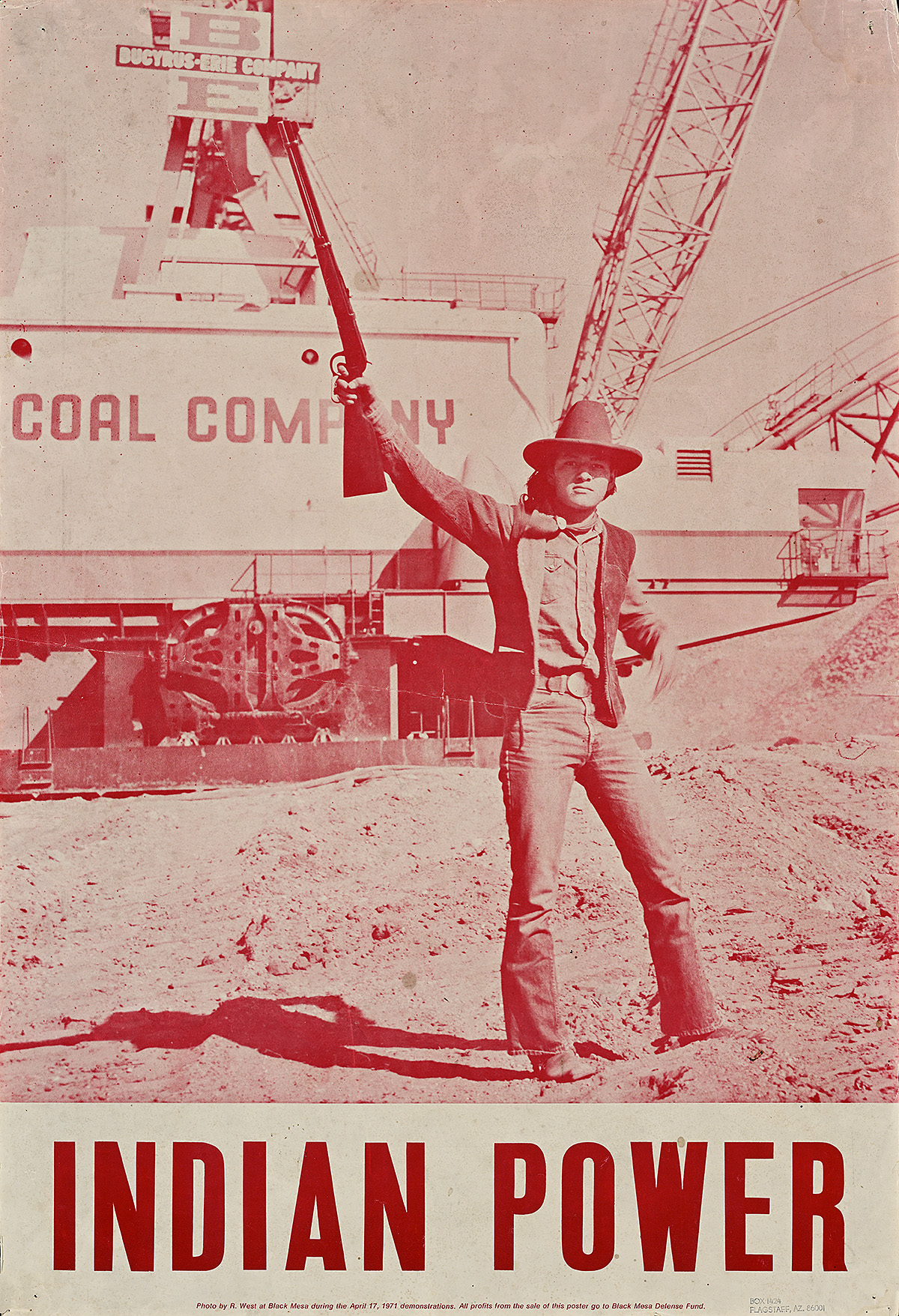 A poster with a red-toned photograph of a young man standing on dirt holding a gun in the air.