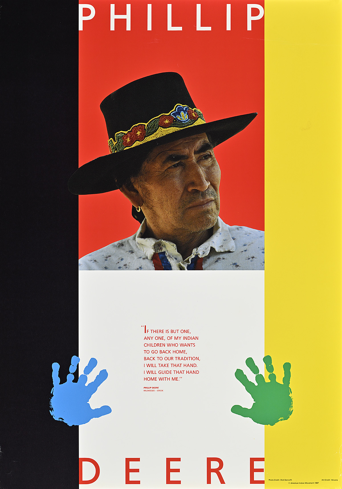 A poster with a photograph of a Native American man's face above blue and green handprints.