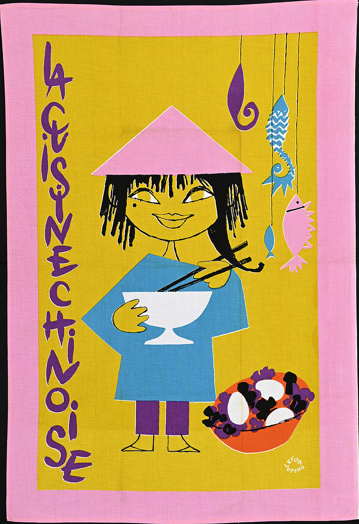 A towel with an illustration of a figure eating out of a bowl with chopsticks.